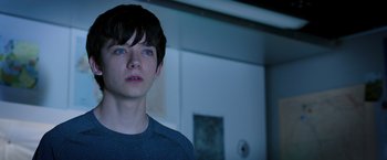 Movie still from “The Space Between Us” (2017), directed by Peter Chelsom – A young man with blue eyes stares into the camera; Close Up shot, Over the shoulder angle