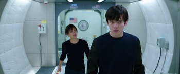 Movie still from “The Space Between Us” (2017), directed by Peter Chelsom – A man and a woman standing next to each other; Medium shot, Over the shoulder angle