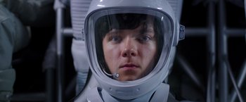 Movie still from “The Space Between Us” (2017), directed by Peter Chelsom – A person wearing a space suit and a helmet; Close Up shot, Overhead angle