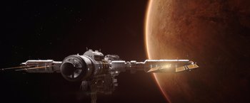 Movie still from “The Space Between Us” (2017), directed by Peter Chelsom – An image of a space ship in front of a planet; Extreme Wide shot, Overhead angle