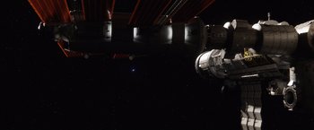 Movie still from “The Space Between Us” (2017), directed by Peter Chelsom – A view of a space station from below it; Extreme Wide shot, Overhead angle