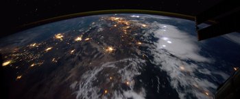 Movie still from “The Space Between Us” (2017), directed by Peter Chelsom – A view of the earth at night taken from space; Extreme Wide shot, Overhead angle