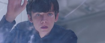 Movie still from “The Space Between Us” (2017), directed by Peter Chelsom – A young boy with blue eyes stares into the distance; Close Up shot, Over the shoulder angle