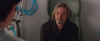 Movie still from “The Space Between Us” (2017), directed by Peter Chelsom – A man with long gray hair wearing glasses; Medium shot, Over the shoulder angle