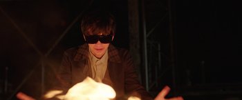 Movie still from “The Space Between Us” (2017), directed by Peter Chelsom – A man in a brown jacket and black sunglasses; Medium shot, Over the shoulder angle