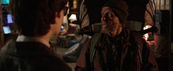 Movie still from “The Space Between Us” (2017), directed by Peter Chelsom – An old man with a beard and a hat is talking to a young man; Medium shot, Over the shoulder angle