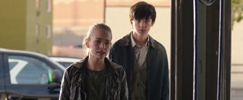 Movie still from “The Space Between Us” (2017), directed by Peter Chelsom – A young man and a young woman standing next to each other; Medium shot, Over the shoulder angle