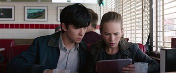 Movie still from “The Space Between Us” (2017), directed by Peter Chelsom – A man and a woman looking at a computer screen; Close Up shot, Over the shoulder angle