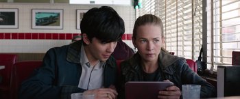 Movie still from “The Space Between Us” (2017), directed by Peter Chelsom – A man and a woman looking at a tablet computer; Close Up shot, Over the shoulder angle