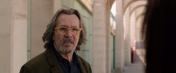 Movie still from “The Space Between Us” (2017), directed by Peter Chelsom – A person wearing glasses and a jacket; Close Up shot, Over the shoulder angle