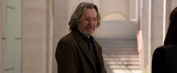 Movie still from “The Space Between Us” (2017), directed by Peter Chelsom – An older man with long gray hair wearing glasses; Close Up shot, Over the shoulder angle