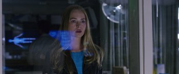 Movie still from “The Space Between Us” (2017), directed by Peter Chelsom – A woman standing in front of a glass window; Close Up shot, Low angle