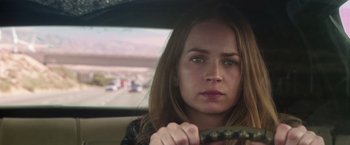 Movie still from “The Space Between Us” (2017), directed by Peter Chelsom – A woman sitting in the driver's seat of a car; Close Up shot, Over the shoulder angle