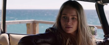 Movie still from “The Space Between Us” (2017), directed by Peter Chelsom – A person sitting on a chair near a body of water; Close Up shot, Over the shoulder angle
