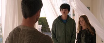 Movie still from “The Space Between Us” (2017), directed by Peter Chelsom – A young man standing in front of another young man; Medium shot, Over the shoulder angle
