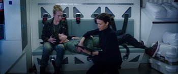 Movie still from “The Space Between Us” (2017), directed by Peter Chelsom – Two women and a man are sitting on a bench; Medium shot, High angle