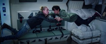 Movie still from “The Space Between Us” (2017), directed by Peter Chelsom – A man and a woman are flying through the air; Medium shot, Overhead angle
