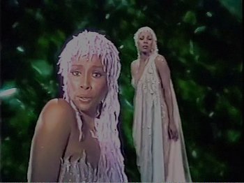 Movie still from “The Star Wars Holiday Special” (1978), directed by Steve Binder – Two women are standing next to each other; Medium shot, Low angle