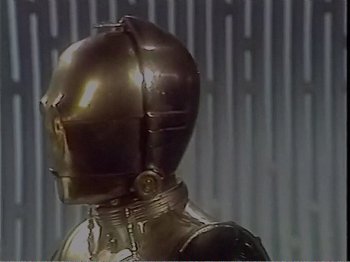 Movie still from “The Star Wars Holiday Special” (1978), directed by Steve Binder – The head of a robot; Close Up shot, High angle