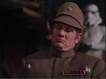 Movie still from “The Star Wars Holiday Special” (1978), directed by Steve Binder – A man wearing a uniform and a hat; Close Up shot, Low angle