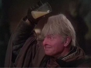 Movie still from “The Star Wars Holiday Special” (1978), directed by Steve Binder – An older man with blonde hair is holding a glass of beer; Close Up shot, Low angle