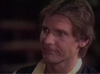 Movie still from “The Star Wars Holiday Special” (1978), directed by Steve Binder – A person wearing a suit and tie; Close Up shot, Over the shoulder angle