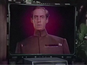 Movie still from “The Star Wars Holiday Special” (1978), directed by Steve Binder – A television screen with a picture of a man in a uniform; Close Up shot, Over the shoulder angle