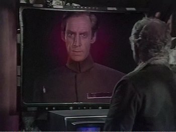 Movie still from “The Star Wars Holiday Special” (1978), directed by Steve Binder – A man watching a television screen with an image of a man on it; Close Up shot, Over the shoulder angle