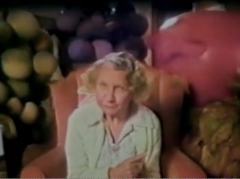 Movie still from “The Star Wars Holiday Special” (1978), directed by Steve Binder – An older woman sitting in a chair in front of a bunch of balloons; Medium shot, High angle