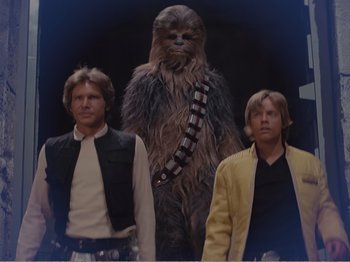 Movie still from “The Star Wars Holiday Special” (1978), directed by Steve Binder – A group of men standing next to each other in a room; Medium shot, Low angle