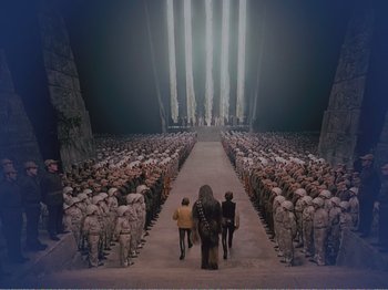 Movie still from “The Star Wars Holiday Special” (1978), directed by Steve Binder – A group of people standing in front of an audience; Extreme Wide shot, Low angle