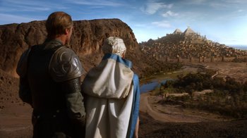Movie still from “Game of Thrones” (2011), created by D.B. Weiss – Two men in medieval garb looking out over a valley; Wide shot, High angle
