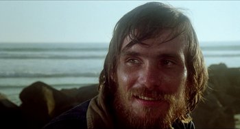 Movie still from “The Stunt Man” (1980), directed by Richard Rush – A person with long hair and a beard; Close Up shot, Low angle