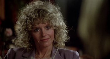 Movie still from “The Stunt Man” (1980), directed by Richard Rush – A person with curly hair; Close Up shot, Low angle