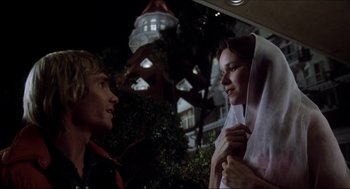 Movie still from “The Stunt Man” (1980), directed by Richard Rush – A man and a woman talking to each other outside; Close Up shot, Low angle