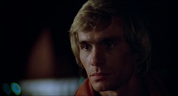 Movie still from “The Stunt Man” (1980), directed by Richard Rush – A person with long blonde hair; Close Up shot, Low angle