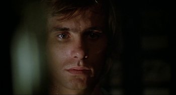 Movie still from “The Stunt Man” (1980), directed by Richard Rush – A man's face in the dark; Close Up shot, Low angle