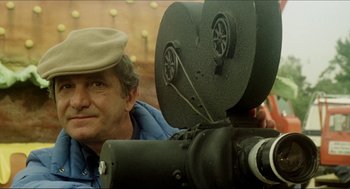 Movie still from “The Stunt Man” (1980), directed by Richard Rush – A person sitting in front of a camera; Close Up shot, Low angle