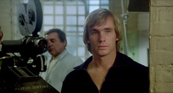 Movie still from “The Stunt Man” (1980), directed by Richard Rush – A person wearing a jacket; Close Up shot, Low angle