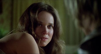 Movie still from “The Stunt Man” (1980), directed by Richard Rush – A person with long brown hair; Close Up shot, Over the shoulder angle