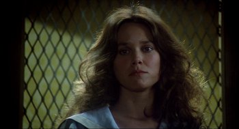 Movie still from “The Stunt Man” (1980), directed by Richard Rush – A person with long brown hair; Close Up shot, Low angle