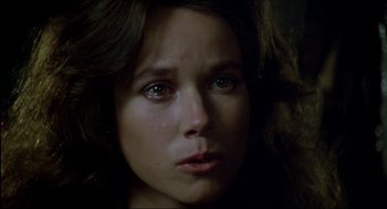 Movie still from “The Stunt Man” (1980), directed by Richard Rush – A woman's face in the dark; Close Up shot, High angle