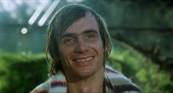 Movie still from “The Stunt Man” (1980), directed by Richard Rush – A person with wet hair smiling; Close Up shot, Low angle