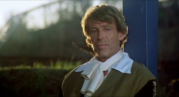 Movie still from “The Stunt Man” (1980), directed by Richard Rush – A person wearing a shirt and tie; Close Up shot, Low angle