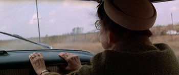 Movie still from “The Sugarland Express” (1974), directed by Steven Spielberg – A woman sitting in the drivers seat of a car; Close Up shot, Over the shoulder angle