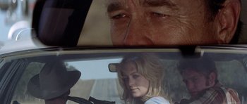 Movie still from “The Sugarland Express” (1974), directed by Steven Spielberg – A man and a woman in the back seat of a car; Close Up shot, Low angle