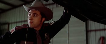 Movie still from “The Sugarland Express” (1974), directed by Steven Spielberg – A man in a cowboy hat and a uniform; Close Up shot, Low angle