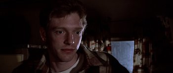 Movie still from “The Sugarland Express” (1974), directed by Steven Spielberg – A person wearing a plaid shirt; Close Up shot, Low angle