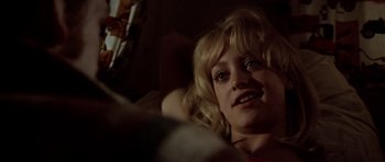 Movie still from “The Sugarland Express” (1974), directed by Steven Spielberg – A woman laying on a bed looking up at the camera; Close Up shot, Low angle