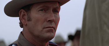 Movie still from “The Sugarland Express” (1974), directed by Steven Spielberg – A person wearing a hat; Close Up shot, Low angle